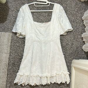 White mini dress with flower details